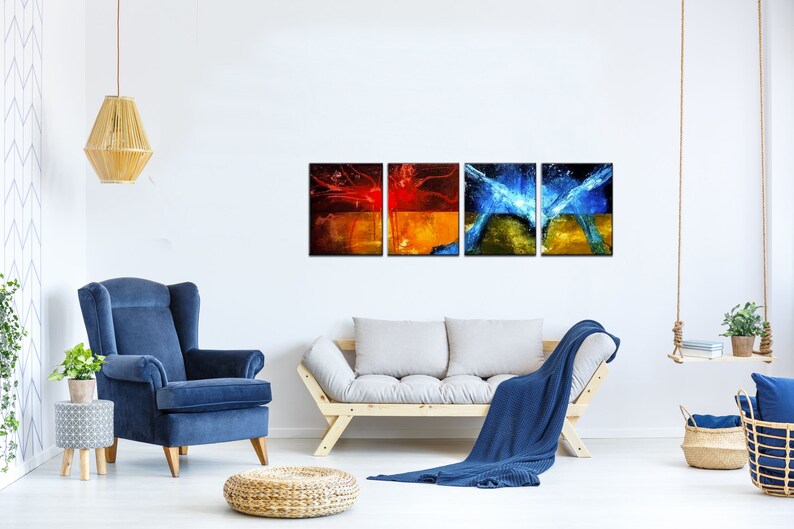 May include: A set of three abstract art prints featuring a mix of red, orange, yellow, blue and green colors. The prints are framed in black and arranged in a row on a white wall.