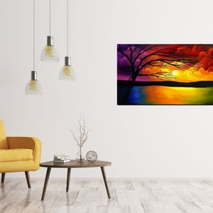 May include: A painting of a sunset over a lake with a silhouetted tree in the foreground. The sky is a vibrant mix of purple, orange, red, and yellow. The water reflects the colors of the sky.