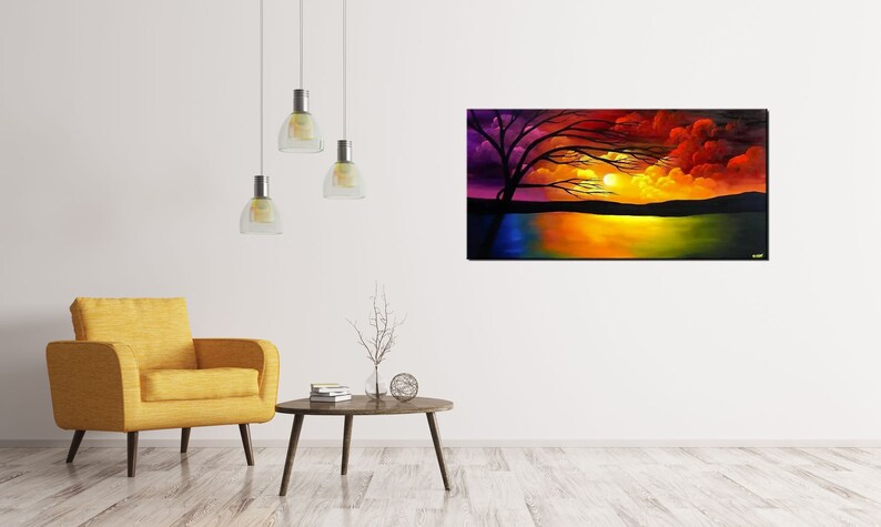May include: A painting of a sunset over a lake with a silhouetted tree in the foreground. The sky is a vibrant mix of purple, orange, red, and yellow. The water reflects the colors of the sky.
