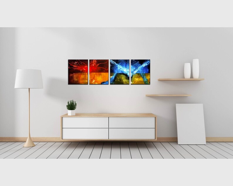 May include: Four abstract art prints with a mix of red, orange, blue, and yellow colors. The prints are arranged in a row on a white wall above a wooden shelf and a white dresser.