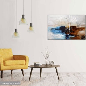 May include: Abstract painting with blue, brown, and white colors. The painting is hanging on a white wall above a yellow armchair and a coffee table with a small tree branch in a vase.