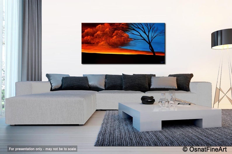 May include: Abstract painting of a fiery orange and red sunset with a dark silhouette of a tree in the foreground. The sky is divided in half, with the left side being the sunset and the right side being a dark blue sky.