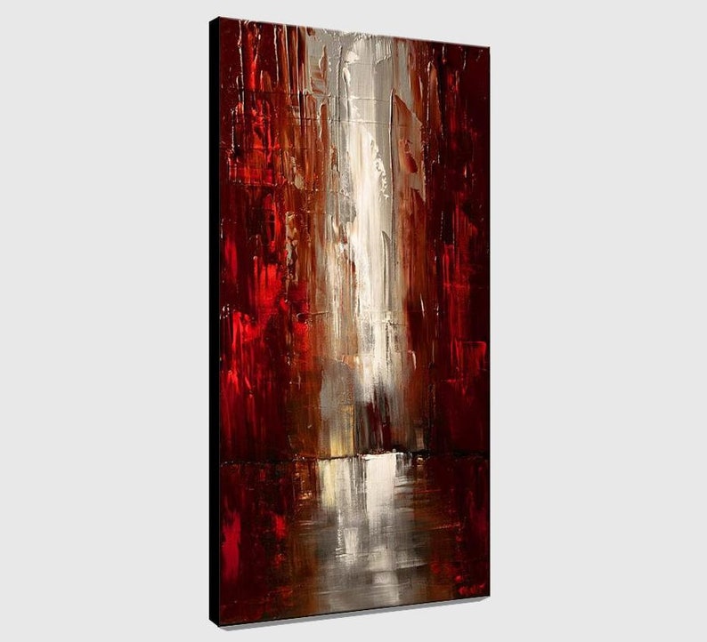 May include: Abstract painting with bold strokes of red, brown, and white paint. The painting has a vertical orientation and a textured surface.