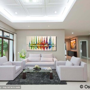 May include: A living room interior with white couches and a coffee table. A large abstract painting of colorful sailboats hangs on the wall. The painting features a reflection of the sailboats in the water.