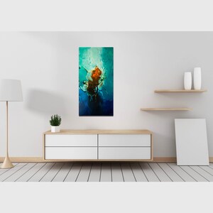 May include: Abstract painting with a blue, green, and orange color scheme. The painting is framed and hanging on a white wall.