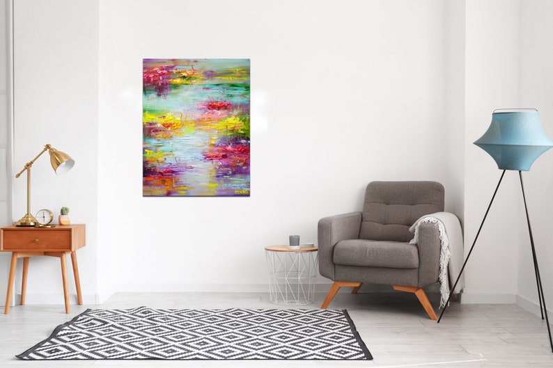 May include: Abstract painting with a colorful, textured style. The painting features a variety of colors, including pink, purple, yellow, green, and blue. The colors are blended together to create a sense of movement and depth. The painting is framed and ready to hang.