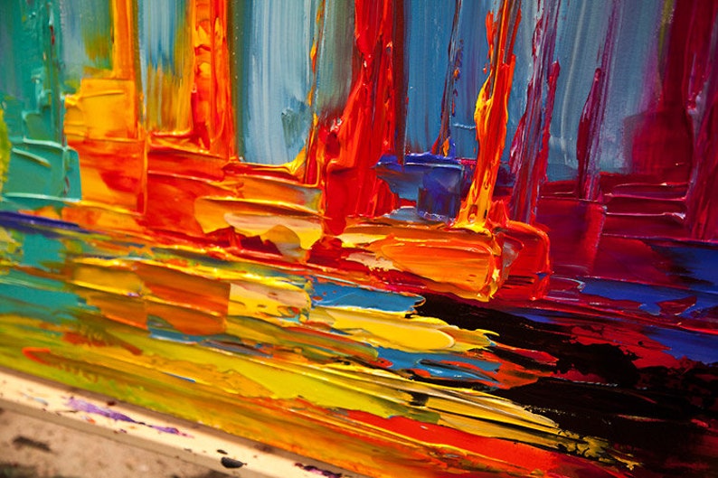 May include: Abstract painting with thick brushstrokes in shades of blue, red, orange, and yellow. The colors are vibrant and create a sense of movement and energy.