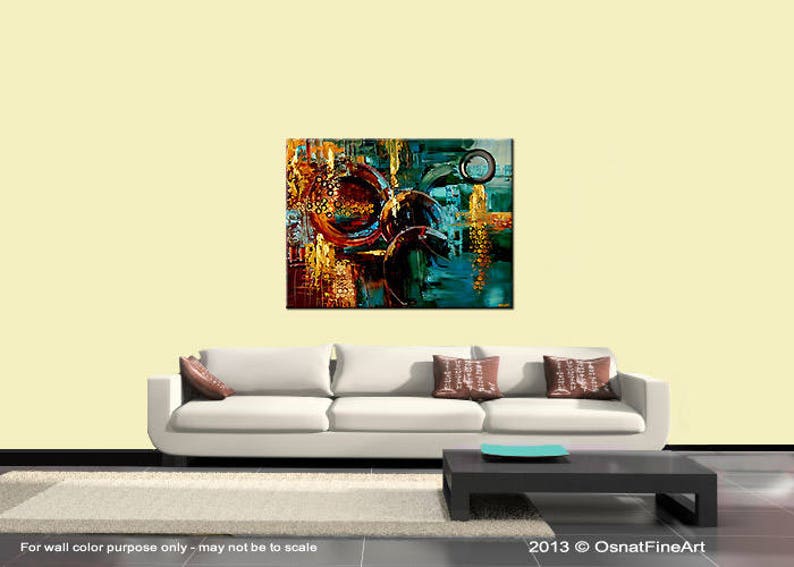 May include: Abstract painting with a mix of gold, brown, blue, and green colors. The painting features a series of overlapping circles and geometric shapes.