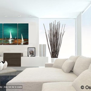 May include: A three-panel abstract painting of sailboats on a teal and turquoise ocean with a golden sunset. The painting is displayed in a modern living room with a white couch and a vase of brown branches.