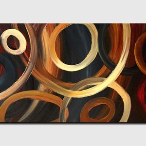 May include: Abstract painting with overlapping circles in shades of brown, gold, and blue. The circles are painted with thick brushstrokes, creating a textured effect.