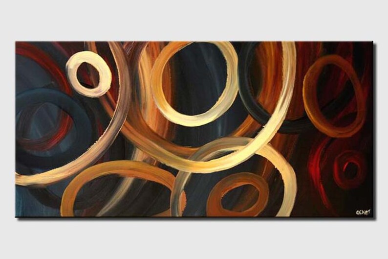 May include: Abstract painting with overlapping circles in shades of brown, gold, and blue. The circles are painted with thick brushstrokes, creating a textured effect.