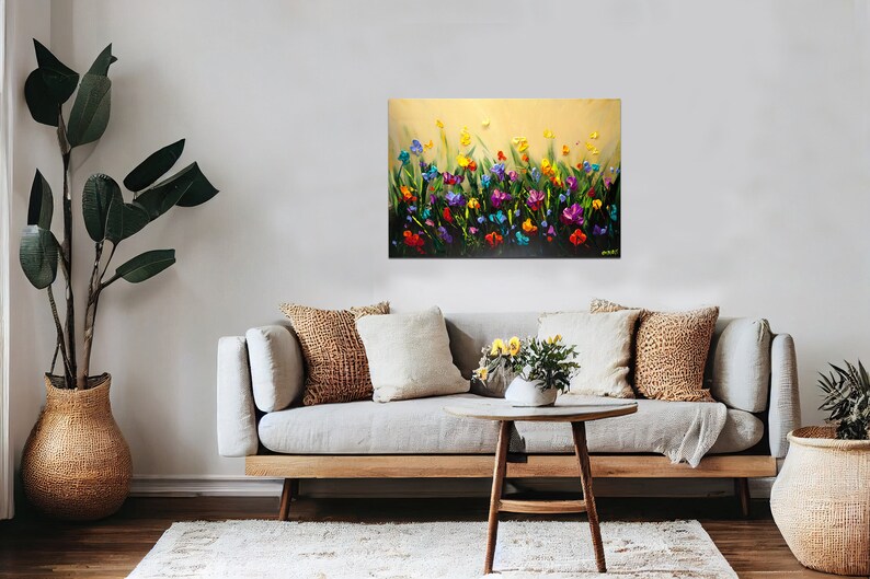 May include: A painting of a field of colorful flowers in shades of pink, purple, yellow, orange, and blue. The flowers are painted in a textured style, giving the painting a three-dimensional effect.