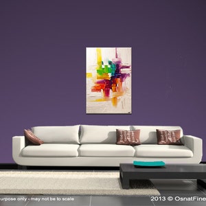 May include: Abstract painting with a white background and colorful geometric shapes in shades of red, orange, yellow, green, blue, and purple. The painting is hanging on a purple wall above a white couch with brown throw pillows.