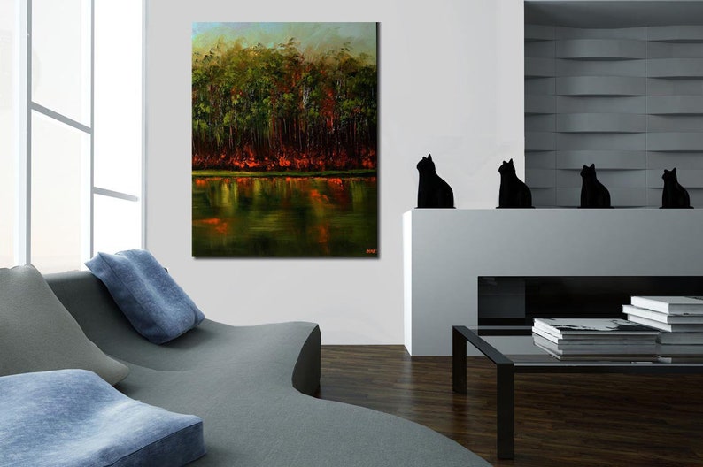 May include: A painting of a forest reflected in a still lake. The trees are a mix of green and brown, with some red leaves. The water is a dark green, with reflections of the trees and sky.