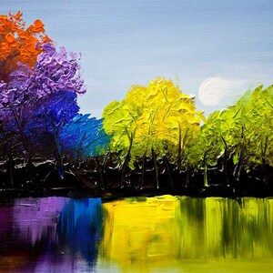 May include: A painting of a lake with a reflection of trees in the water. The trees are painted in a rainbow of colors, from purple to orange. The sky is a light blue with a white moon.
