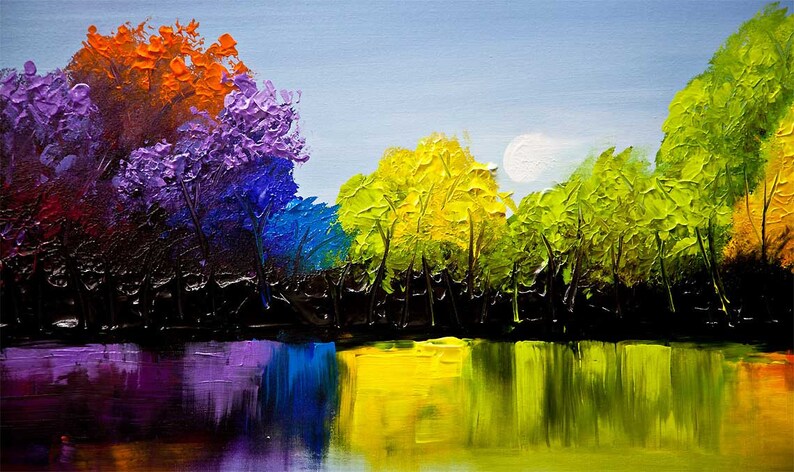May include: A painting of a lake with a reflection of trees in the water. The trees are painted in a rainbow of colors, from purple to orange. The sky is a light blue with a white moon.