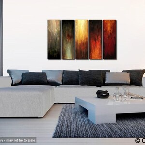 May include: Abstract art piece composed of five vertical panels. Each panel features a blend of colors, including shades of brown, gold, red, and black, creating a textured, flowing effect. The artwork is displayed above a modern white sectional sofa.
