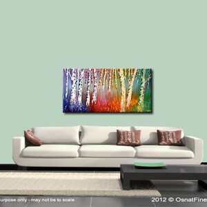 May include: Abstract painting of a forest with colorful trees. The trees are painted in shades of blue, green, yellow, orange, and red. The painting is on a canvas and is framed. The painting is hanging on a wall in a living room.
