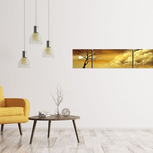 May include: A three-piece canvas wall art set featuring a silhouette of a tree with a bright yellow and orange sunset background.