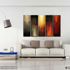 May include: Abstract art piece composed of five vertical panels. Each panel features a unique color palette, ranging from dark brown and gold to fiery red. The artwork hangs above a white sofa in a modern living room setting.