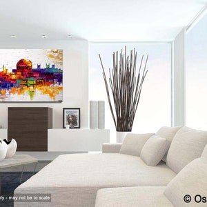 May include: Abstract painting of a cityscape with a large dome building in the center. The painting is done in a palette of bright colors, including yellow, orange, red, purple, and blue. The painting is displayed on a white wall in a modern living room setting.