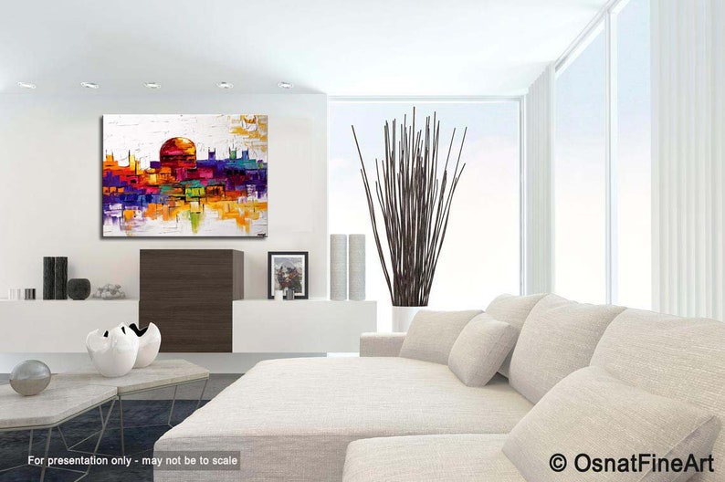 May include: Abstract painting of a cityscape with a large dome building in the center. The painting is done in a palette of bright colors, including yellow, orange, red, purple, and blue. The painting is displayed on a white wall in a modern living room setting.