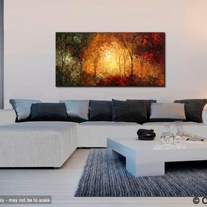 May include: Abstract painting of a forest scene with trees in shades of green, yellow, orange, and red. The painting is displayed on a white wall above a white sectional sofa with gray pillows and a white coffee table.
