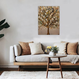 May include: A painting of a gold and green tree with a textured surface. The painting is hanging on a wall in a living room setting with a couch, coffee table, and plants.
