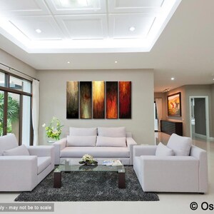 May include: A modern living room with white sofas, a glass coffee table, and a dark gray rug. The focal point is a five-panel abstract artwork with vertical streaks of color. The room has large windows and a neutral color palette.