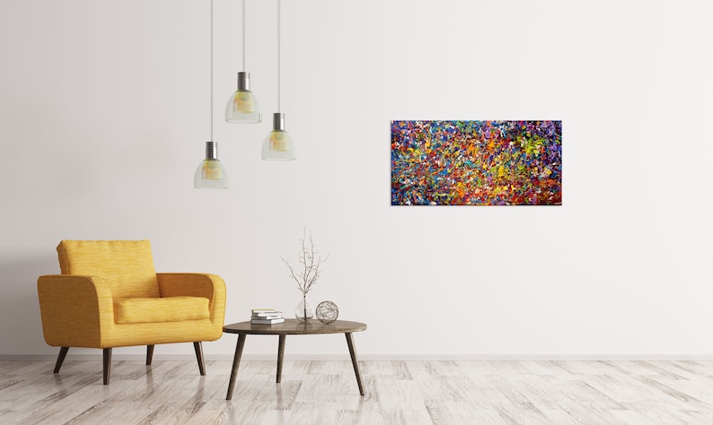 May include: Abstract painting with a colorful, textured, and vibrant design. The painting features a mix of colors, including red, orange, yellow, green, blue, purple, and white. The painting is framed and hanging on a white wall.