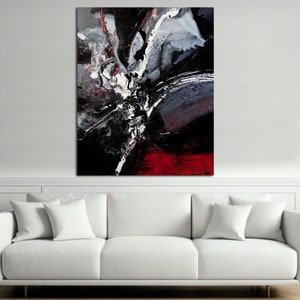 May include: Abstract painting with black, white, and red paint splatters and streaks. The painting has a modern and contemporary style.