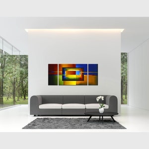 May include: Abstract art print with a geometric design in shades of blue, green, yellow, orange, and red. The print is divided into three panels and features a series of overlapping squares and rectangles.