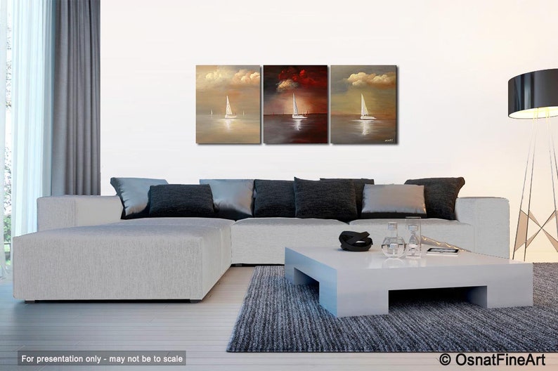 May include: A set of three abstract paintings depicting sailboats on a body of water with a cloudy sky. The paintings are in shades of brown, red, and beige.