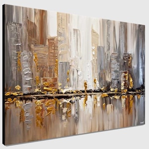 May include: Abstract painting of a city skyline in shades of gray, brown, and gold. The city is reflected in a body of water at the bottom of the painting.