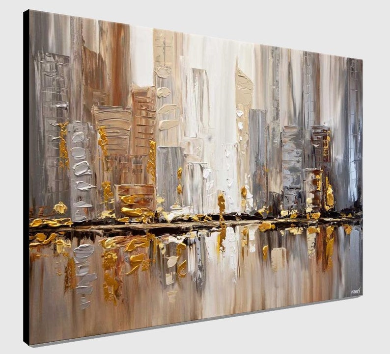 May include: Abstract painting of a city skyline in shades of gray, brown, and gold. The city is reflected in a body of water at the bottom of the painting.