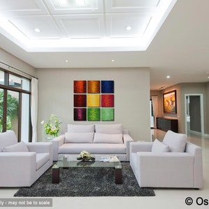 May include: A modern living room with white couches and a coffee table. A colorful abstract painting hangs on the wall above the couch.