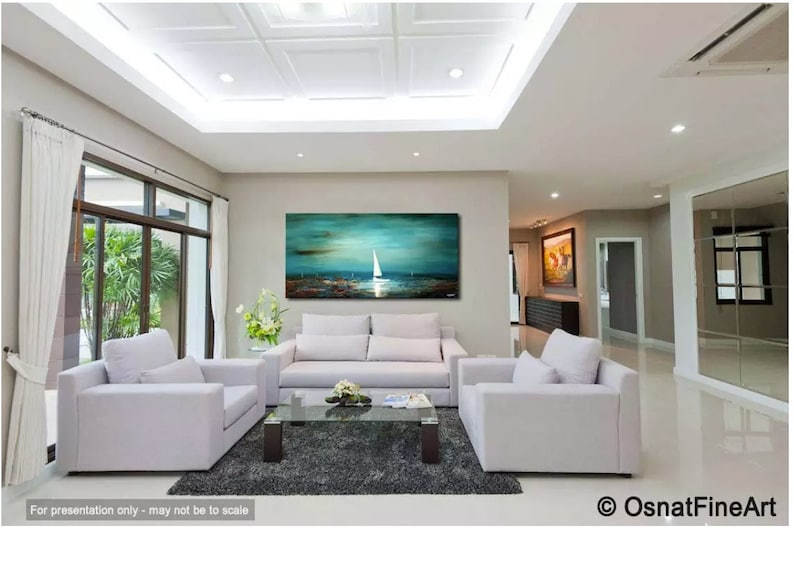 May include: A large abstract painting of a sailboat on a turquoise sea with a dark blue sky. The painting is hanging on a wall in a living room with white couches and a glass coffee table.
