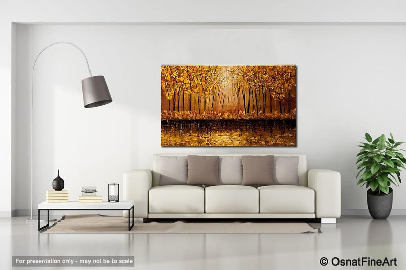 May include: A painting of a golden forest with a lake in the foreground. The trees are tall and slender, and their leaves are a vibrant yellow. The lake is calm and reflective, and the sun is shining brightly through the trees.