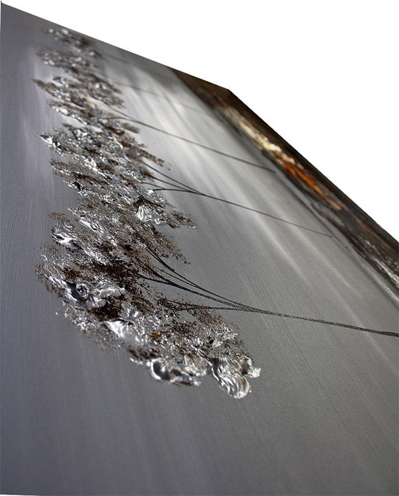 May include: Abstract painting on canvas featuring a silver and brown textured design. The painting depicts a series of stylized trees with branches extending to the right. The background is a light gray color.