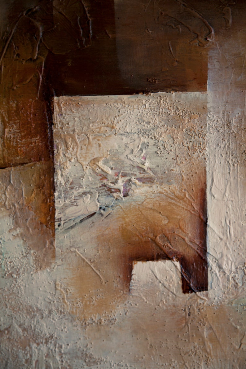 May include: Abstract painting with textured brown and beige paint. The painting has a layered look with different shades of brown and beige.