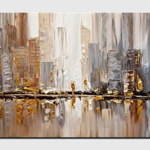 May include: Abstract painting of a city skyline in shades of gray, brown, and gold. The city is reflected in a body of water at the bottom of the painting.