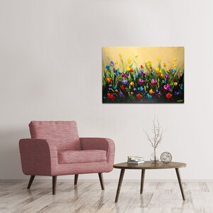 May include: A colorful painting of a field of flowers in shades of purple, blue, yellow, red, and orange. The flowers are painted in a textured style, giving the painting a three-dimensional effect.