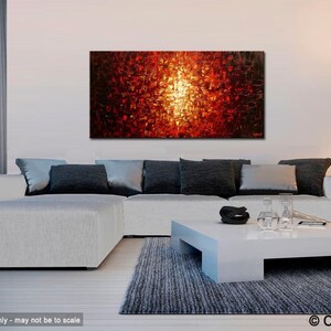 May include: Abstract painting with a bright yellow center surrounded by red, orange, and black squares. The painting is hanging on a white wall above a white sectional sofa with gray pillows. A white coffee table with a black bowl and clear glasses sits in front of the sofa.