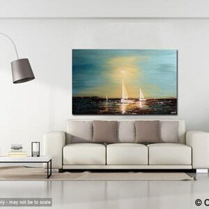 May include: A painting of a seascape with sailboats in the distance. The sky is a light blue with a yellow sun shining through the clouds. The water is a dark blue with a reflection of the sun. The painting is framed and hanging on a white wall in a living room setting.