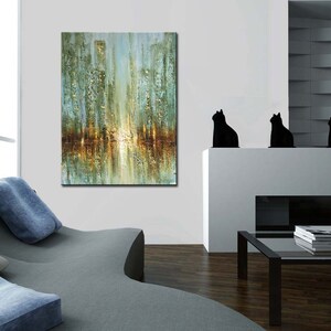 May include: Abstract painting of a city skyline with a reflection of the buildings in the water. The painting is in shades of blue, green, and gold.
