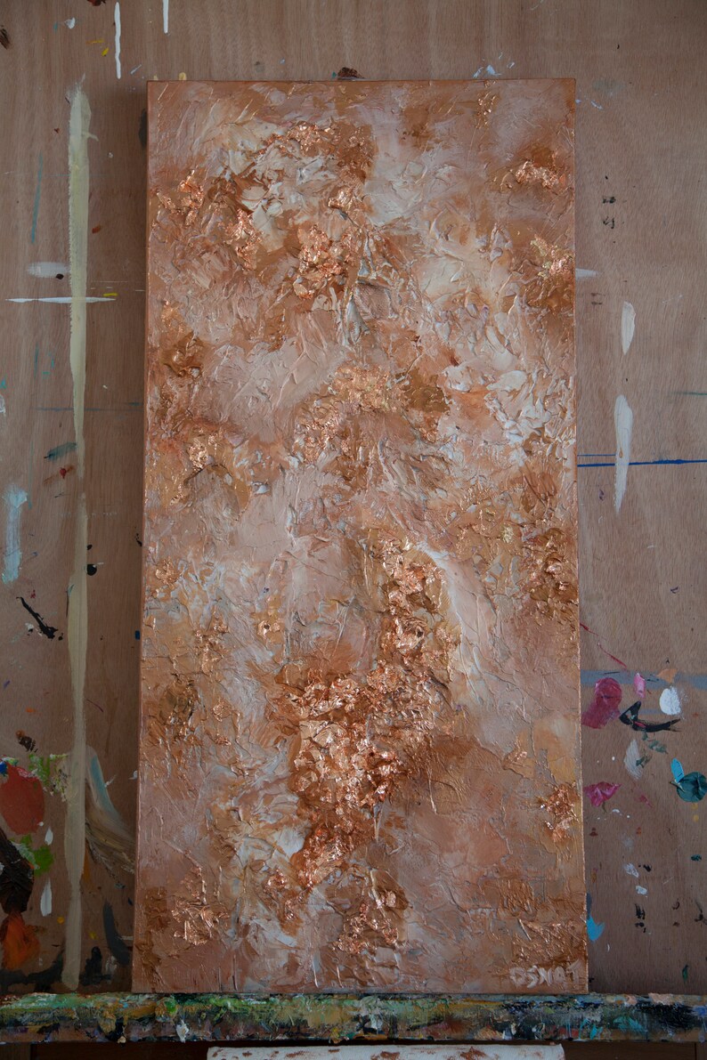 May include: Abstract painting on canvas with a textured surface. The painting features a mix of white and brown paint with gold leaf accents.