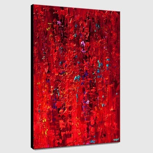 May include: Abstract painting with a red background and splashes of blue, purple, and yellow paint.