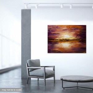 May include: Abstract painting of a sunset over a lake with purple, orange, and gold hues. The painting is displayed on a white wall in a modern interior setting.