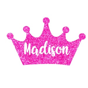 May include: Pink glitter crown with the name Madison written in white inside.
