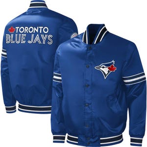 May include: A blue satin jacket featuring the Toronto Blue Jays logo and team name. The jacket has white stripes on the sleeves and a white and navy blue collar and hem. The Blue Jays logo is on the front.